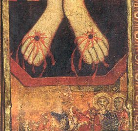 Figuras a los pies de Cristo